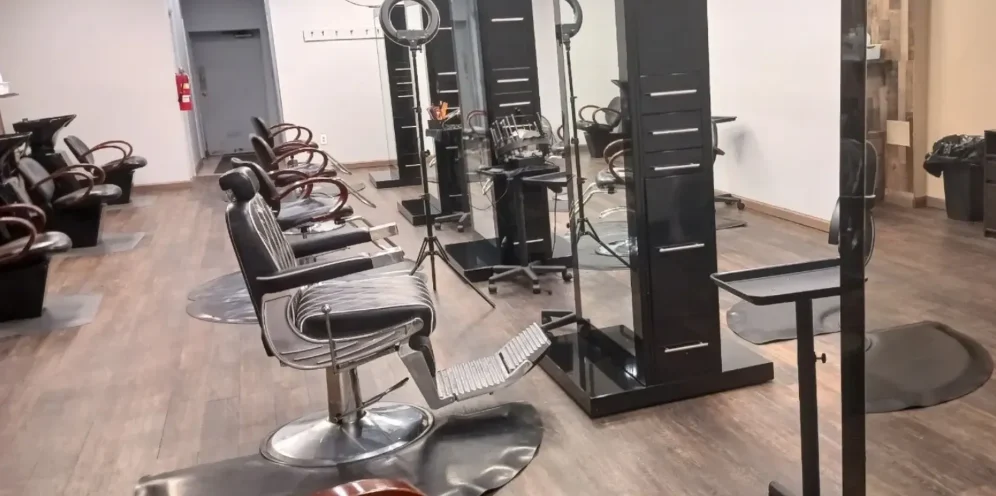 Inside Flossy's Hair Designs: styling chairs, mirrors and shampoo bowls